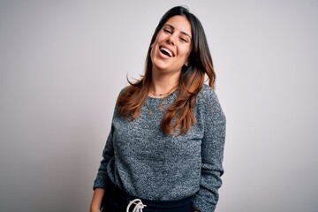 Canvas Print - Young beautiful brunette woman smiling happy and confident. Standing with smile on face wearing casual sweater over isolated white background