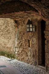 Old stone buildings and arched narrow streets in the picturesque medieval city of Eze Village in the South of France along the Mediterranean Sea