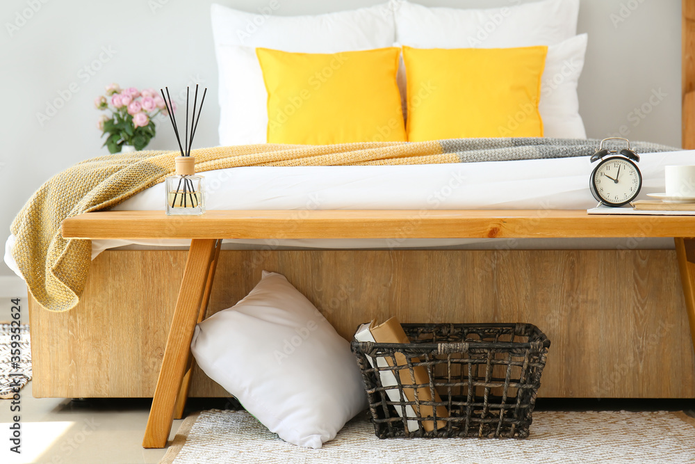 Big bed and bench in interior of modern room