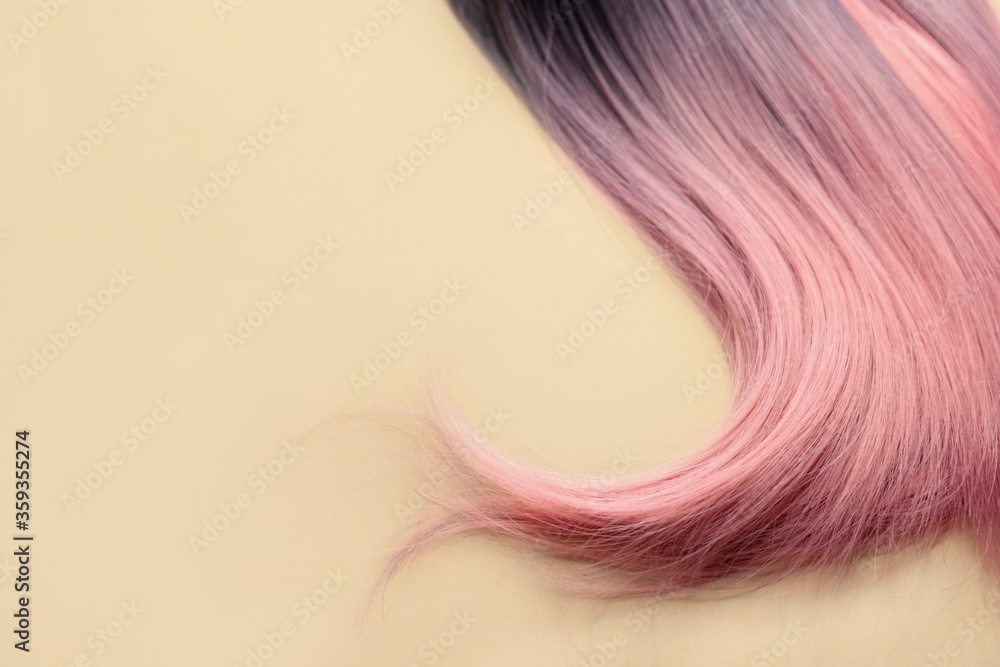 Unusual wig on color background