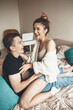 © Strelciuc - Lovely young couple lying in bed and embracing while smiling in the weekend