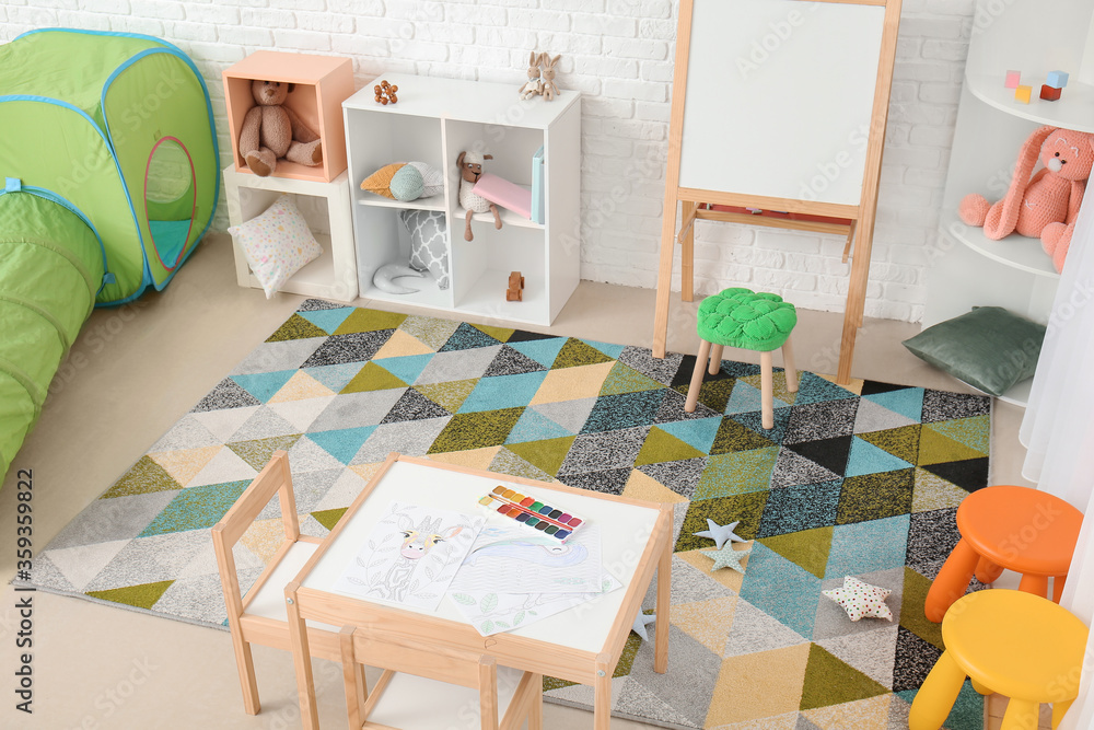 Stylish interior of modern playroom in kindergarten
