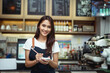 © PK Studio - New generation women do small business in coffee shop counter