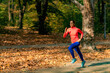 © Microgen - Woman Jogging Outdoors in Park