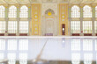 The interior of a mosque, with white marble floor.