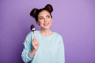 Wall Mural - Portrait of her she nice attractive pretty dreamy curious cheerful girl holding in hand spoon fantasizing counting calories isolated on violet purple lilac bright vivid shine vibrant color background