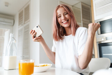 Sticker - Photo of woman making winner gesture while playing online game