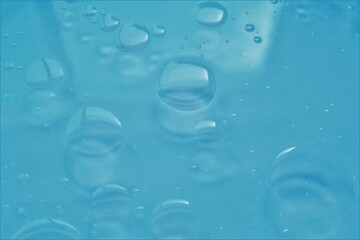 Water drops on light blue background