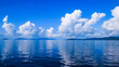 Landscape view of white clouds on blue sky above the ocean and and island