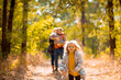 © andrey - little girl runs. family with children walking in autumn Park. walks in nature