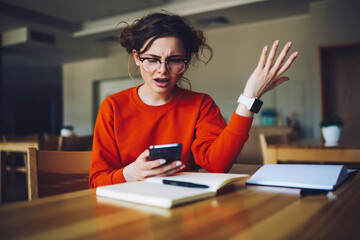 Wall Mural - angry attractive female feeling disappointed receiving bill from banking service checking email box 