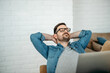 © bnenin - Handsome man with laptop relaxing, portrait. Enjoying free time at home.