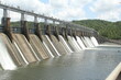 Impressive spillway on a Hydroelectric dam, with forest trees in the background
