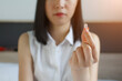 © Jirattawut - young woman taking pill,  taking drugs. Medicines at work