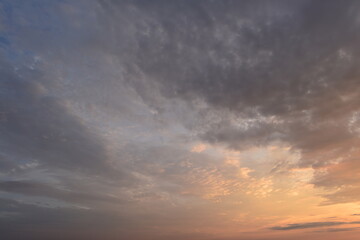 Wall Mural - Dusk sky glowing in the clouds at sunset