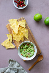 Mexican dip sauce guacamole with nachos chips. Mexican food. Healthy eating. Vegetarian food.