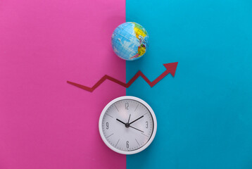 Wall Mural - White clock and globe, red growth arrow on pink blue background. Top view