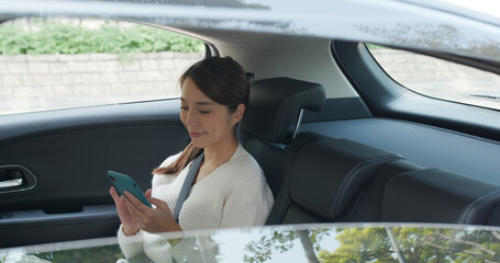 Wall Mural - Woman use of mobile phone in car