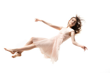 mid-air beauty cought in moment. full length shot of attractive young woman hovering in air and keep