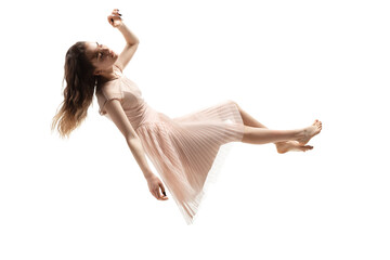 mid-air beauty cought in moment. full length shot of attractive young woman hovering in air and keep