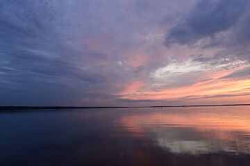 Wall Mural - Lake blue calm water under the twilight summer sky