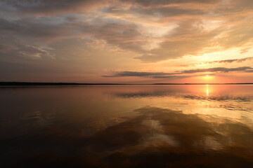 Wall Mural - Sunbeam on the mirror water lake at sunset