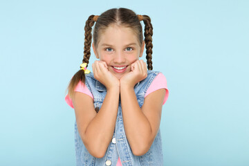 Wall Mural - Young beautiful girl on blue background