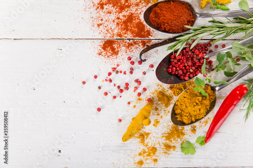 Various colorful spices on wooden table, top view. Canvas Print