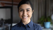 Head shot of millennial successful indian ethnicity businesswoman smile looking at camera. Promoted talented or promising employee close up, best worker of month sales manager company portrait concept