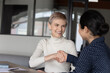 © fizkes - Applicant successfully pass job interview got hired international company position feels happy shake hands HR indian ethnicity manager. Client and insurer make deal handshaking express regard concept