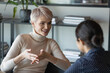 © fizkes - Confident short-haired businesswoman talk with client during formal meeting in office. HR manager applicant interaction at job interview communication. Two diverse mates discuss common project concept