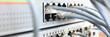 © H_Ko - Close-up of network cables connected to framework. Internet switch station. Bunch of grey plugs. Telecommunication main distribution frame. Server and modern technology data center concept