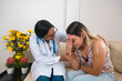 © Hector Pertuz - Image of the Latina doctor advising a patient