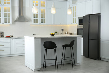 Poster - Beautiful kitchen interior with new stylish furniture