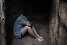 Human Trafficking Concept.Young Girl Sitting In Old Room.teenager Girl Victims Of Trafficking.