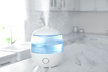 Wall Mural - Modern air humidifier on table in kitchen