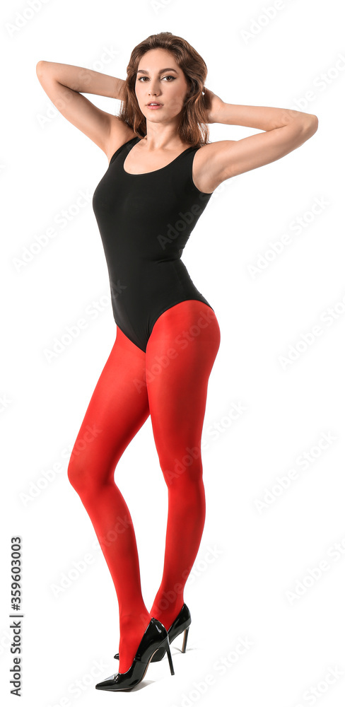 Beautiful young woman in tights on white background