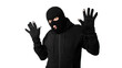 Arrested masked thief with raised arms isolated on white wall