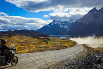 Biker on the Long Beautiful Road to the Mountains in the Torres Del Paine National Park, Chile 