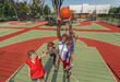© Prostock-studio - Black basketball player jumping to score goal and his team at outdoor court