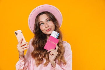 Poster - Image of dreaming woman holding passport with ticket and mobile phone