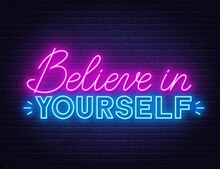 Believe In Yourself Neon Quote On A Brick Wall. Inspirational Glowing Lettering.