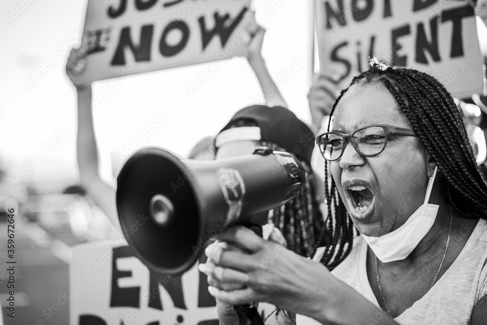 Crowd of people demonstrators protest in city street against racism ...