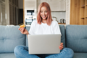 Poster - Lovely young attractive woman relaxing on a couch