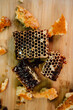 honeycombs on a wooden board with honey on it