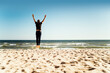 © eunikas - Happy man jumping on the beach