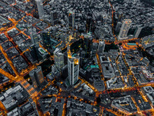 Aerial Overhead View Of Frankfurt Am Main, Germany Skyline At Night With Glowing Streets