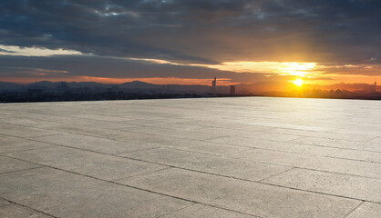 Empty concrete floor with city background