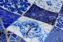 Detail Of Blue Broken Glass Mosaic Tile, Decoration In Park Guell, Barcelona, Spain By Antoni Gaudi