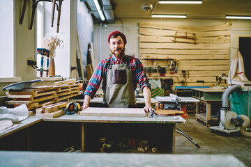 Wall Mural - half length portrait of prosperous male owner of crafts store and workshop satisfied with successful